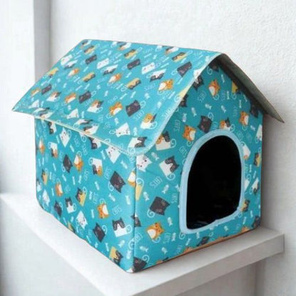 Maison pour les chats sur mur blanc Guangdong
